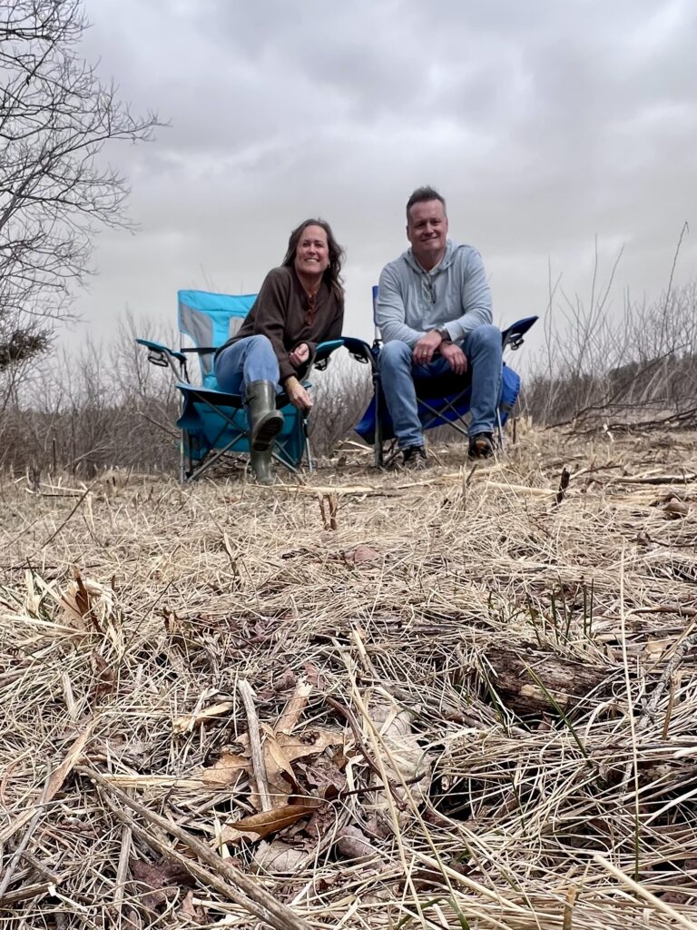 woman and man sitting on on open land
