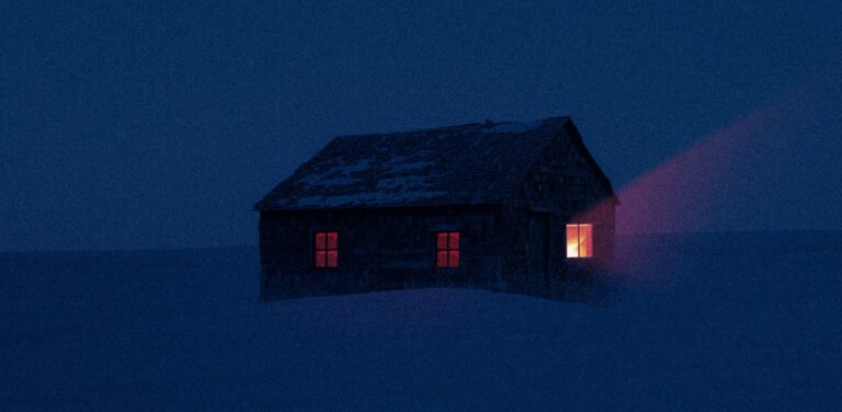 A solitary cabin with glowing windows in a snowy landscape under a dark night sky.