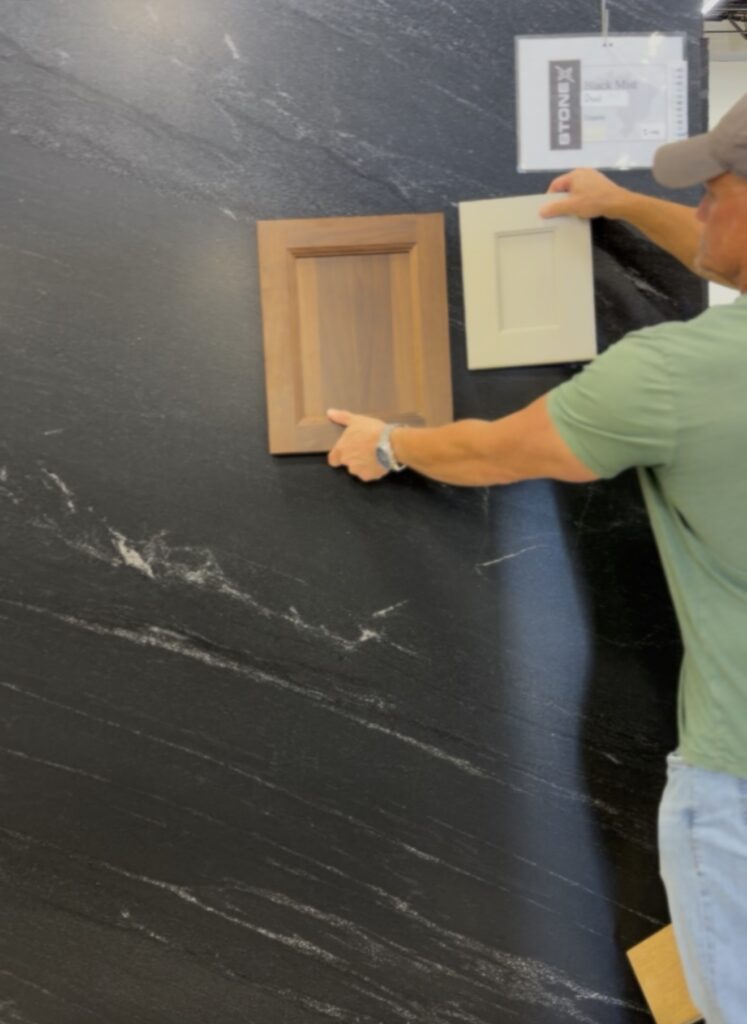 Honed Black Mist granite alongside natural walnut shaker cabinet door samples
