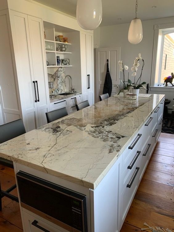 Patagonia quartzite slab with dramatic natural movement and light and dark tones